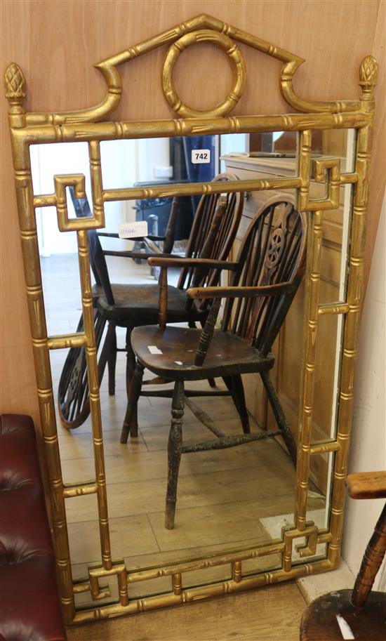 A gilt bamboo effect wall mirror H.124cm